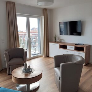 TV - 50.4.M Ankerplatz - Modern, high-quality vacation apartment, sauna, large balcony, (Wangerland)