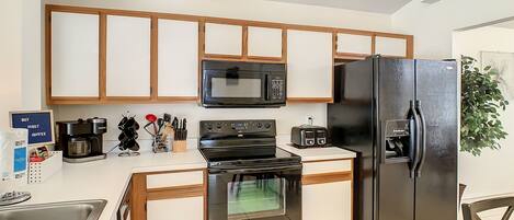 Microwave, dishwasher, coffee/tea maker, cookware/dishes/utensils