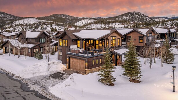 A snow-covered residential area with multiple houses featuring large windows and balconies. - Hot Tub + Shuttle - On the Corner at The Shores (Breckenridge)