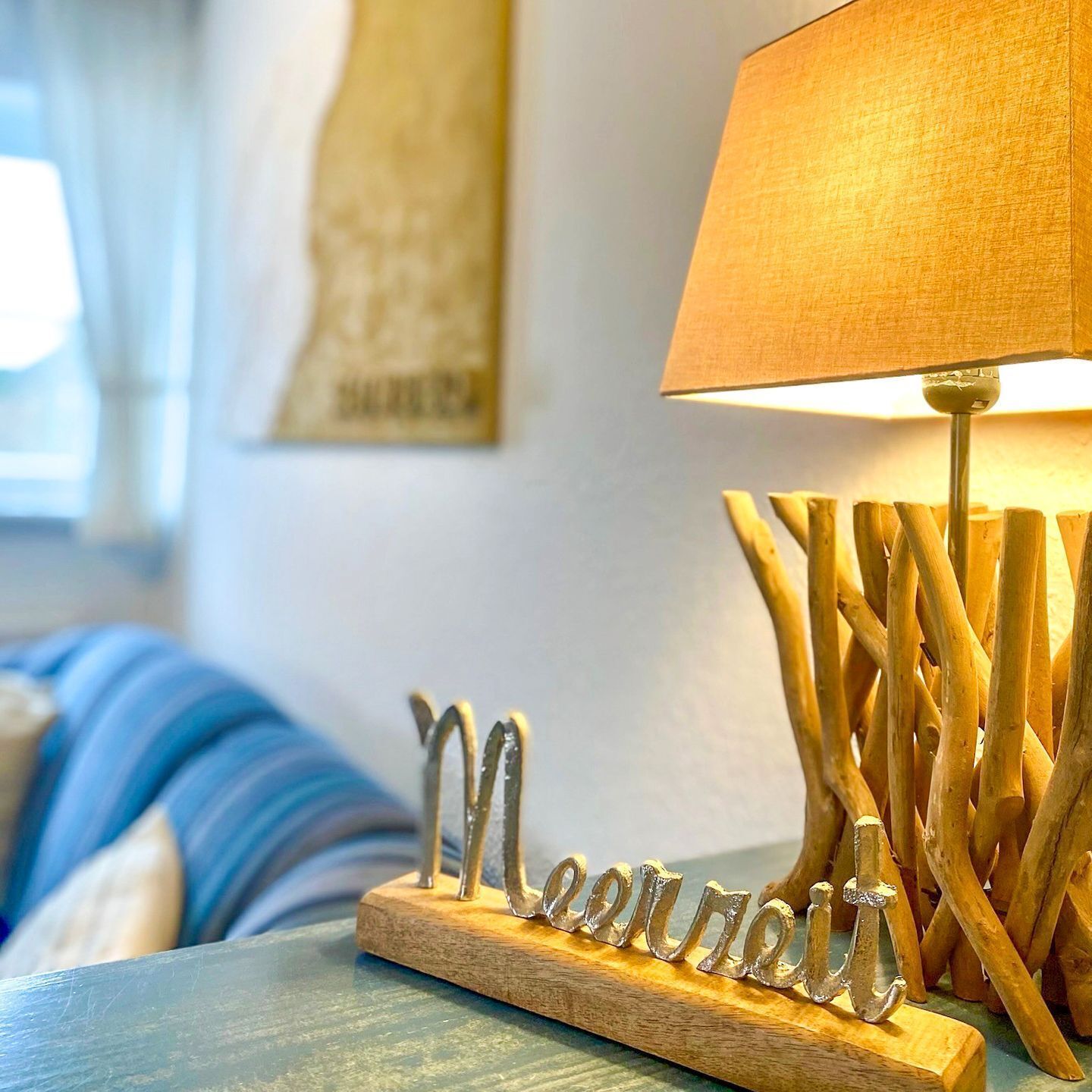 A lamp with a wooden base and a metal nameplate reading "Maureen."
