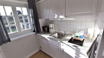 Fridge, stovetop, dishwasher, coffee/tea maker