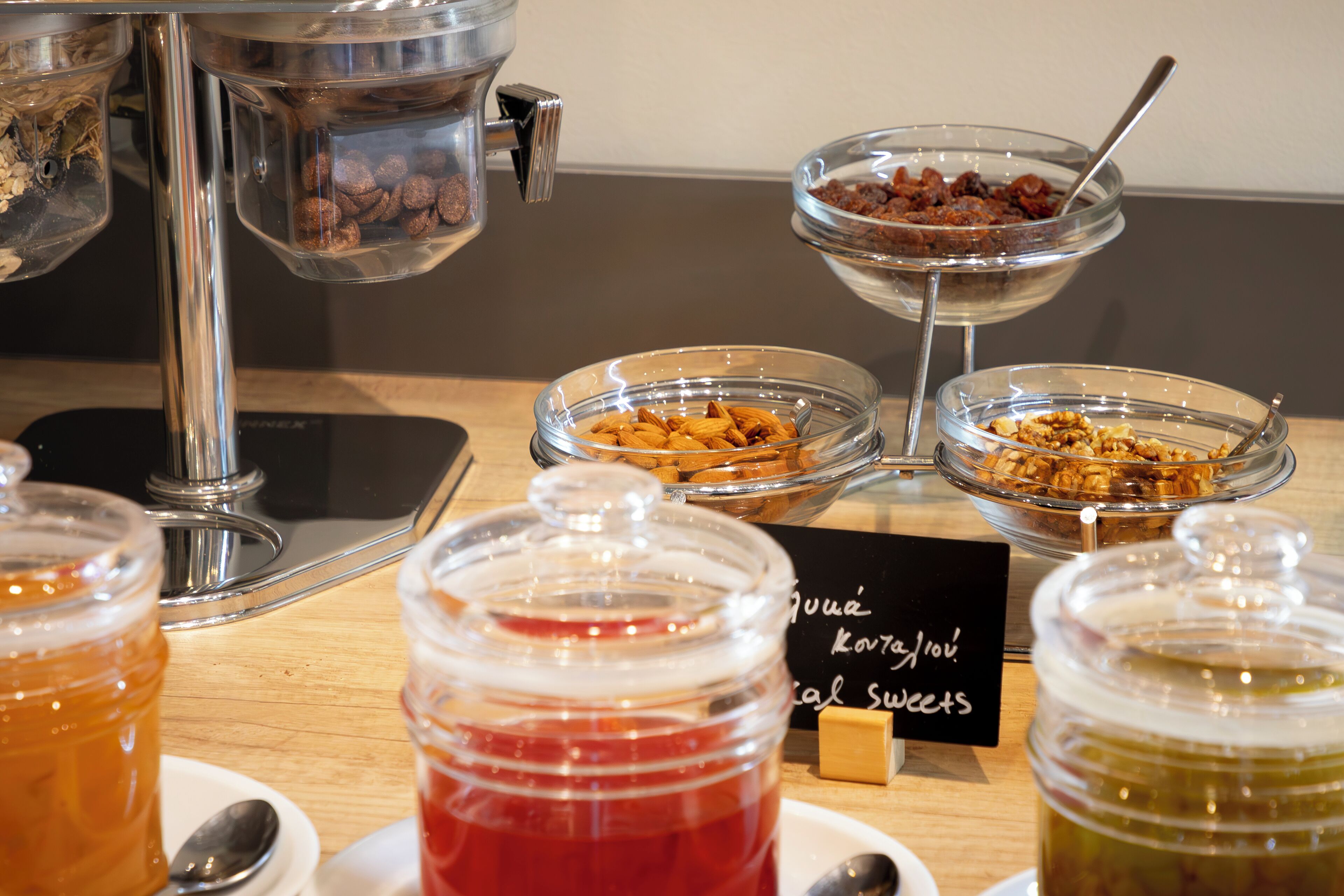 A buffet with various food items and condiments.