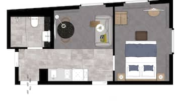 A one-bedroom apartment layout with a bathroom, kitchenette, living area, and a bed.