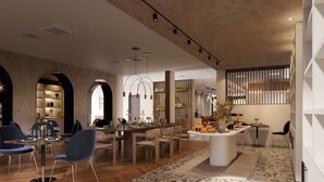 A modern dining area with a long table, chairs, and a central island with a vase.