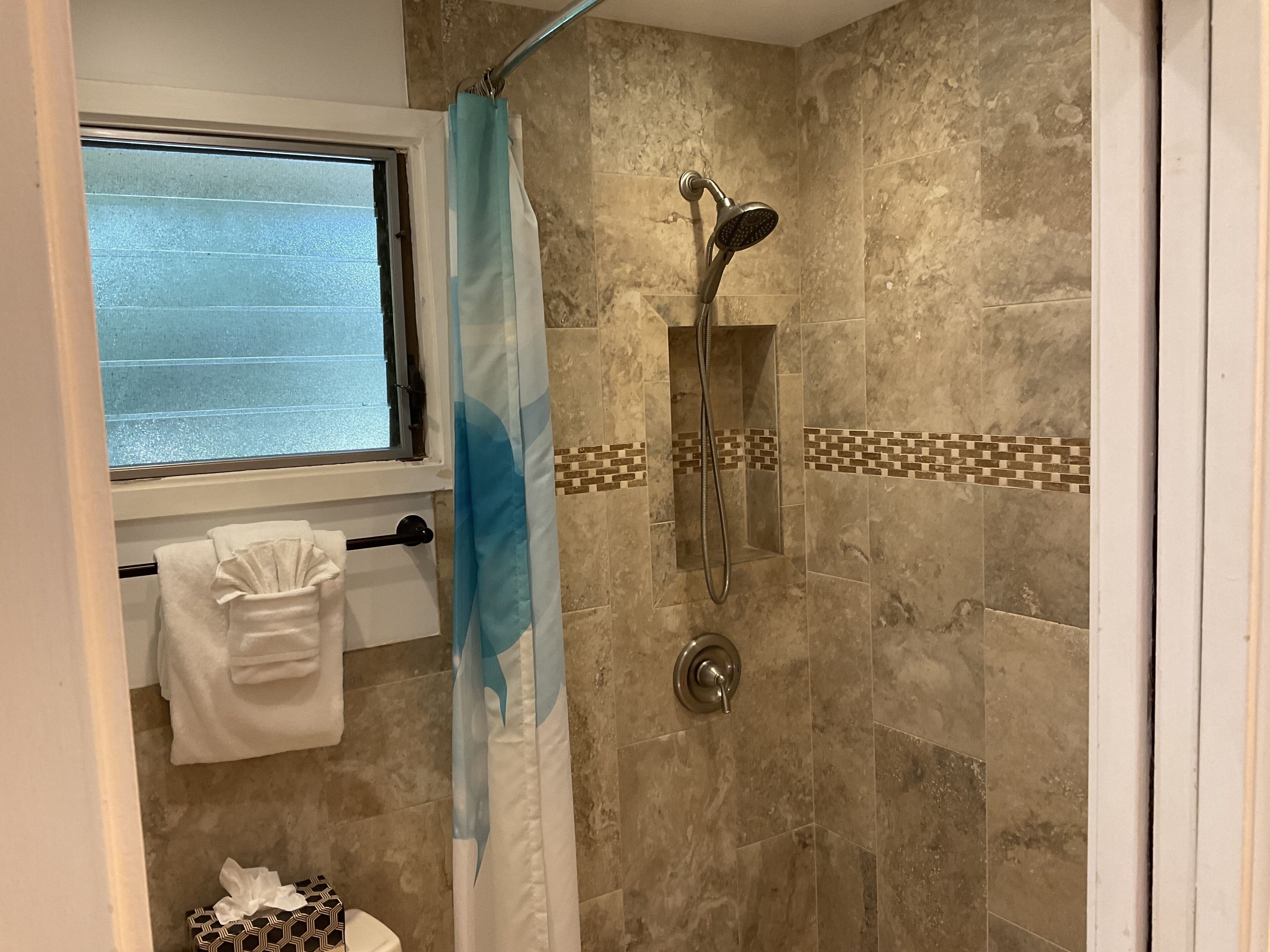 Shower, hair dryer, towels, soap