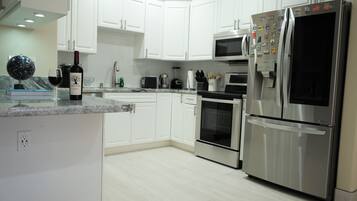 Design Apartment, Non Smoking, 2 Bathrooms | Private kitchen | Full-sized fridge, microwave, oven, stovetop