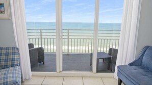 A balcony with a view of the beach and ocean. - Oceanfront Beach Escape Ocean Walk Resort Daytona Beach (Daytona Beach)