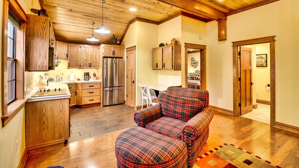A spacious kitchen with wooden cabinets and a stainless steel refrigerator. - Want to REALLY get away? Round Bottom Roost. Secluded. Close to everything. (Mountain View)