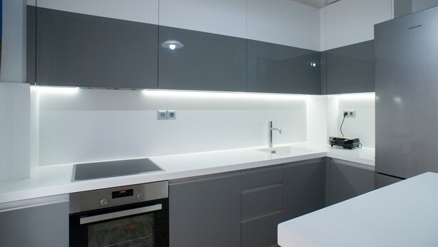 A modern kitchen with a built-in oven, a sink, and a stainless steel refrigerator. - Modern design - Lux 1 B Apart. -15 m. from Acropolis! (Athina)