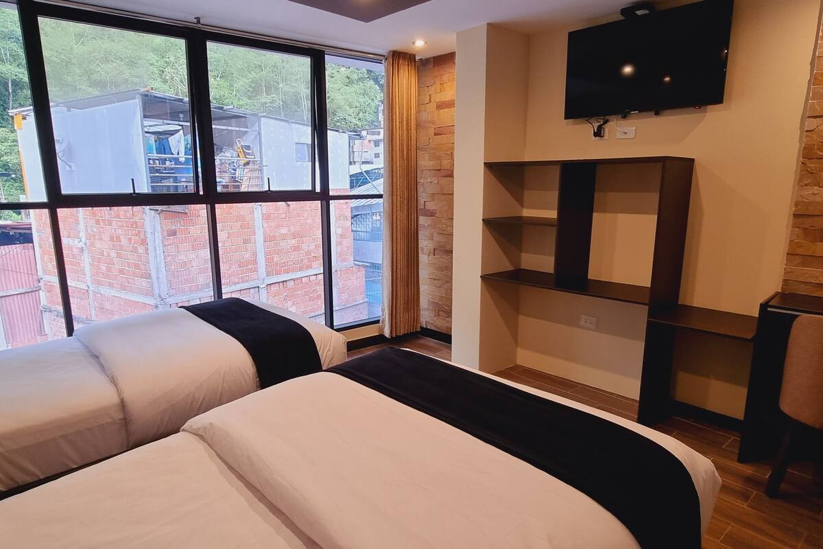 family room | down duvets, pillow-top beds, desk, laptop workspace