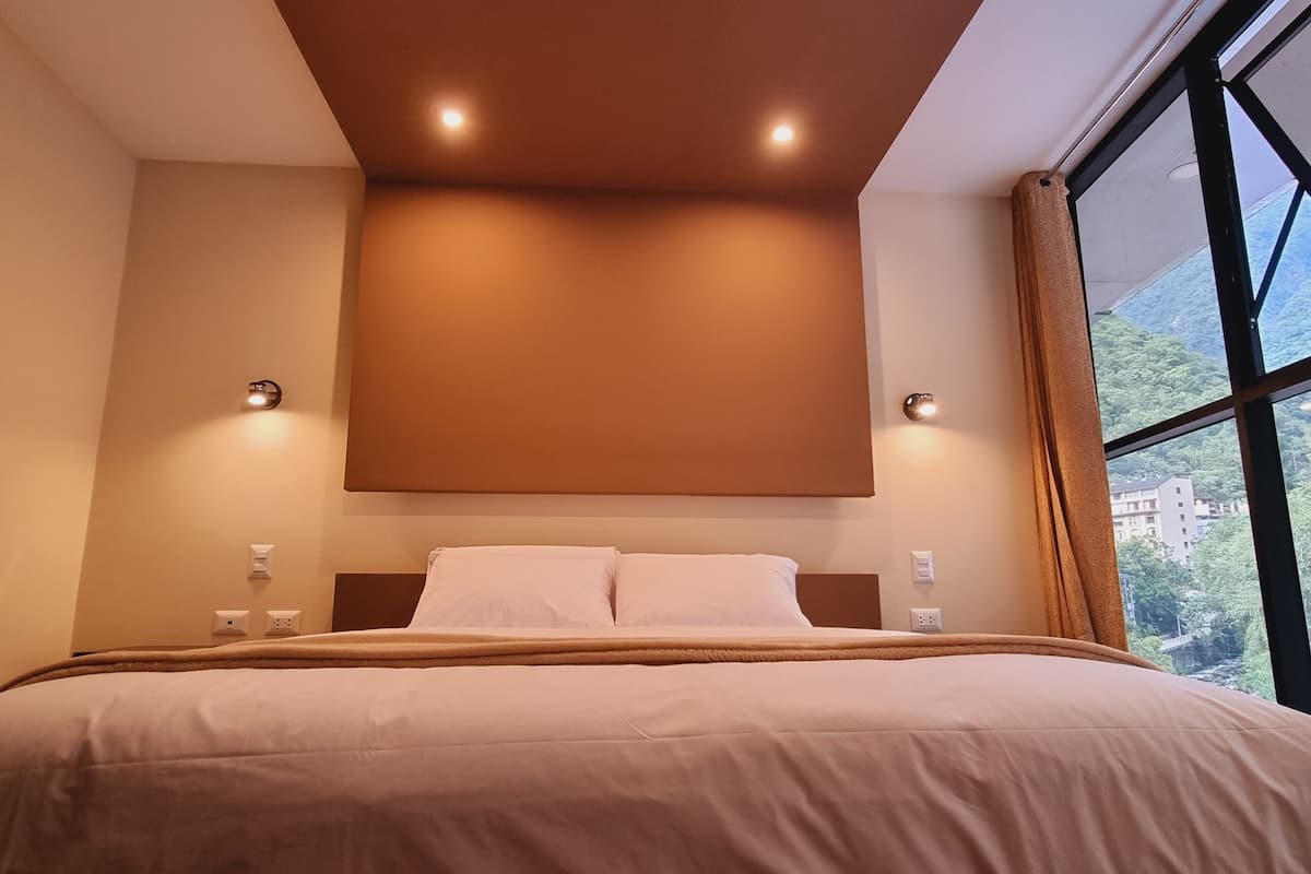 panoramic double room, 1 queen bed, ensuite, mountain view | down duvets, pillow-top beds, desk, laptop workspace