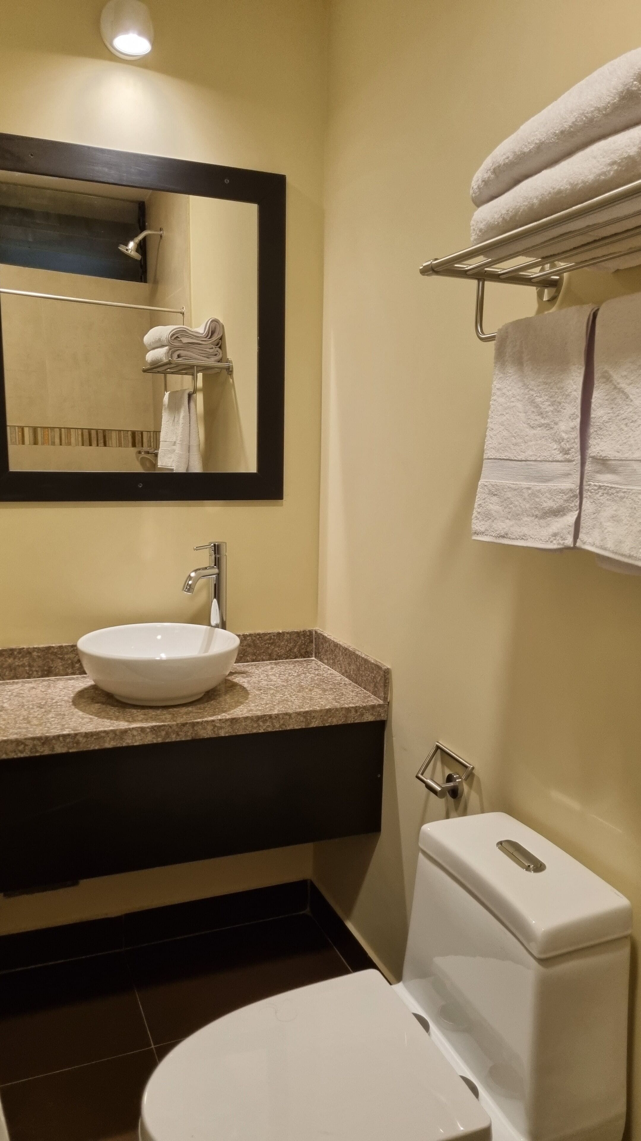 shower, rainfall showerhead, hair dryer, towels