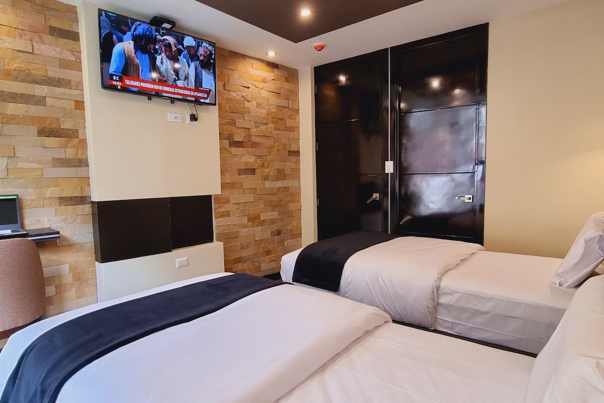 family room | down duvets, pillow-top beds, desk, laptop workspace