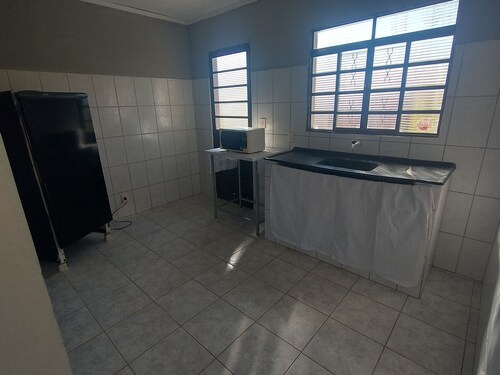 Huge farm with pool, game room and lots of green.