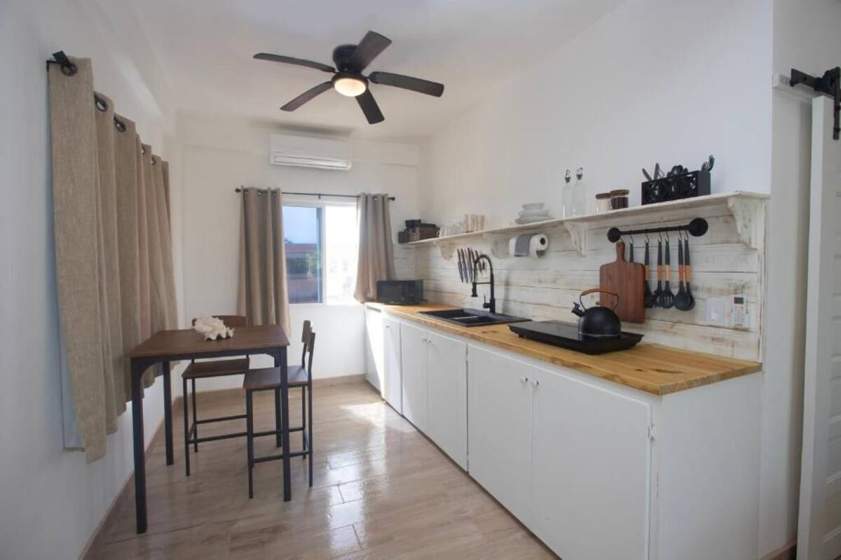 xunantunich, deluxe studio suite | living area | 50-inch smart tv with digital channels, tv