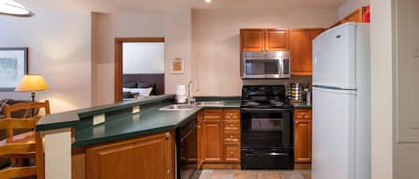 Condo, 2 Bedrooms | Private kitchen | Fridge, oven, coffee/tea maker, toaster