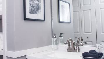 Combined shower/tub, hair dryer, towels, soap