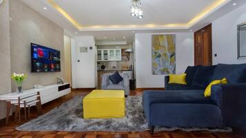 Departamento, 1 habitación | Área de sala de estar | Televisión de pantalla plana