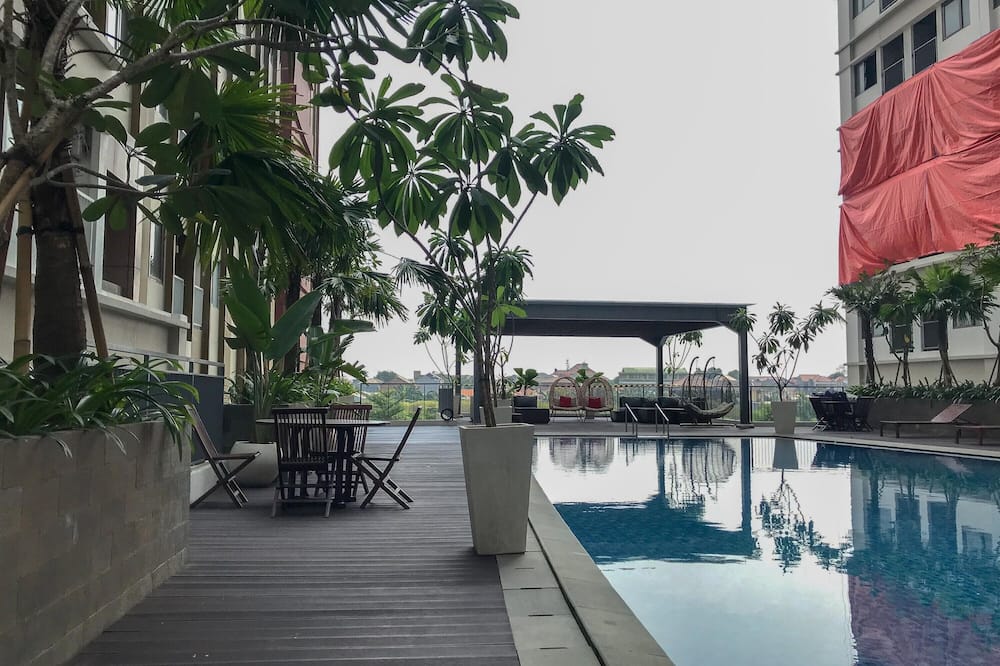 Comfortable Pool View Studio Room at LRT City Jatibening Apartment