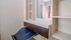 A room with a vanity, mirror, and open shelving. - Modern Furnished 3Br At Springlake Summarecon Bekasi Apartment (Bekasi)