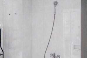 Room | Bathroom | Shower, free toiletries, towels - Comfy And Minimalist Studio Room At Serpong Garden Apartment (Cisauk)