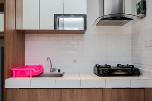 Room | Private kitchen - Minimalist And Warm Studio Casa De Parco Apartment (Pagedangan)