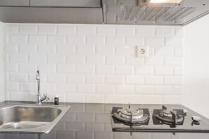 Room | Private kitchen - Stunning Studio Apartment At Belmont Residence Puri (Jakarta)