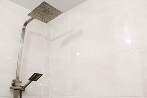 Room | Bathroom | Shower, free toiletries, towels, shampoo - Comfy And Minimalist Studio At Mustika Golf Residence Apartment (Cikarang)