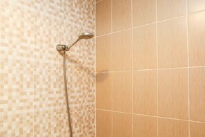 Room | Bathroom | Shower, free toiletries, towels, shampoo - Cozy And Tidy Studio At The Enviro Apartment (Cikarang)