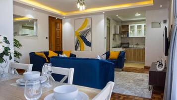 Departamento, 1 habitación | Área de sala de estar | Televisión