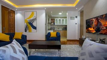 Apartment, 1 Bedroom | Living area | TV