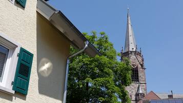 A church with a tall spire and a clock tower.