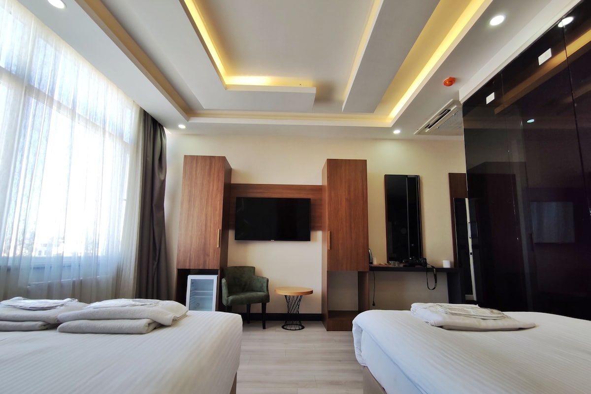 Suite familiar | 1 habitación, tabla de planchar con plancha, wifi gratis y ropa de cama