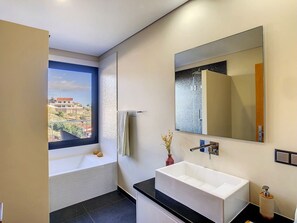 Bathtub, hair dryer, towels
