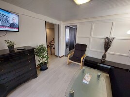 Economy Apartment, Non Smoking, Private Bathroom | Living area | 50-cm flat-screen TV with digital channels, TV