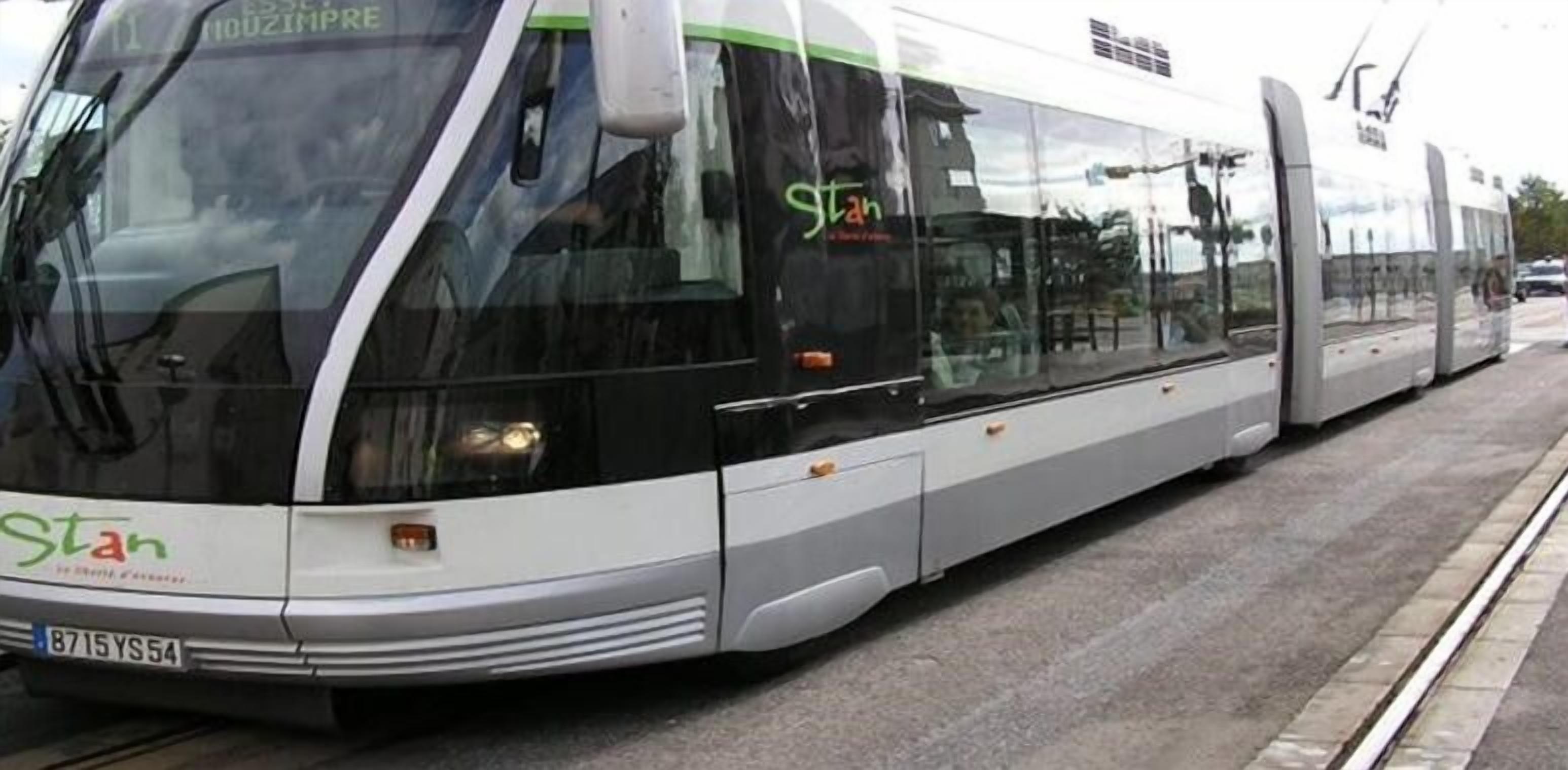 A modern tram with the logo "stan" on the front.