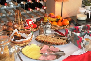 A breakfast buffet with various food items and condiments. - Hotel Roc de St Miquel (Soldeu)