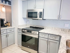 Fridge, microwave, oven, stovetop - Renovated Condo Direct Oceanfront and Bay View Balconies - 1 bedroom - 1 bath - Sleeps 6 - New Queen & Double beds in Bedroom and Queen Sleep Sofa in Living Room (Ocean City)