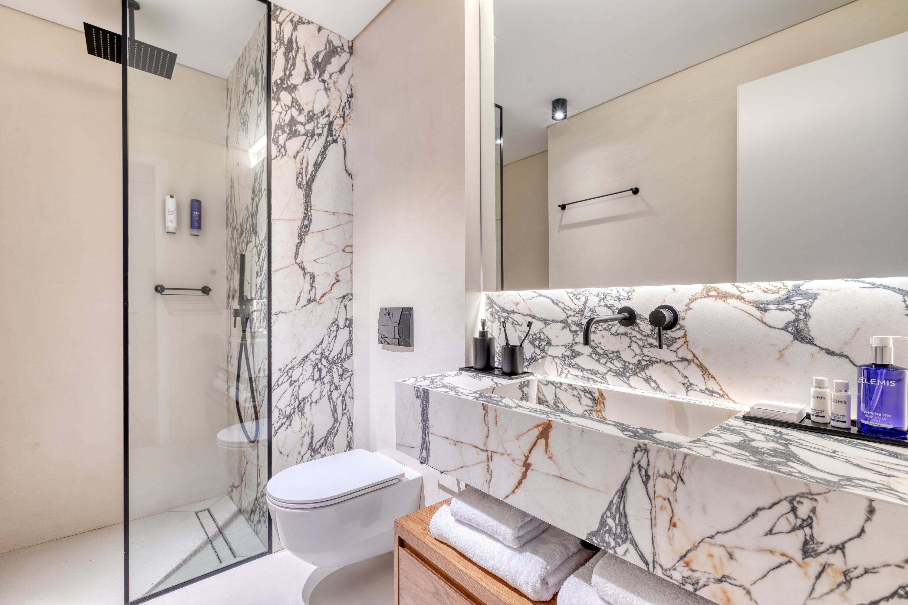 basement cozy room with shared patio | bathroom | shower, eco-friendly toiletries, hair dryer, bathrobes