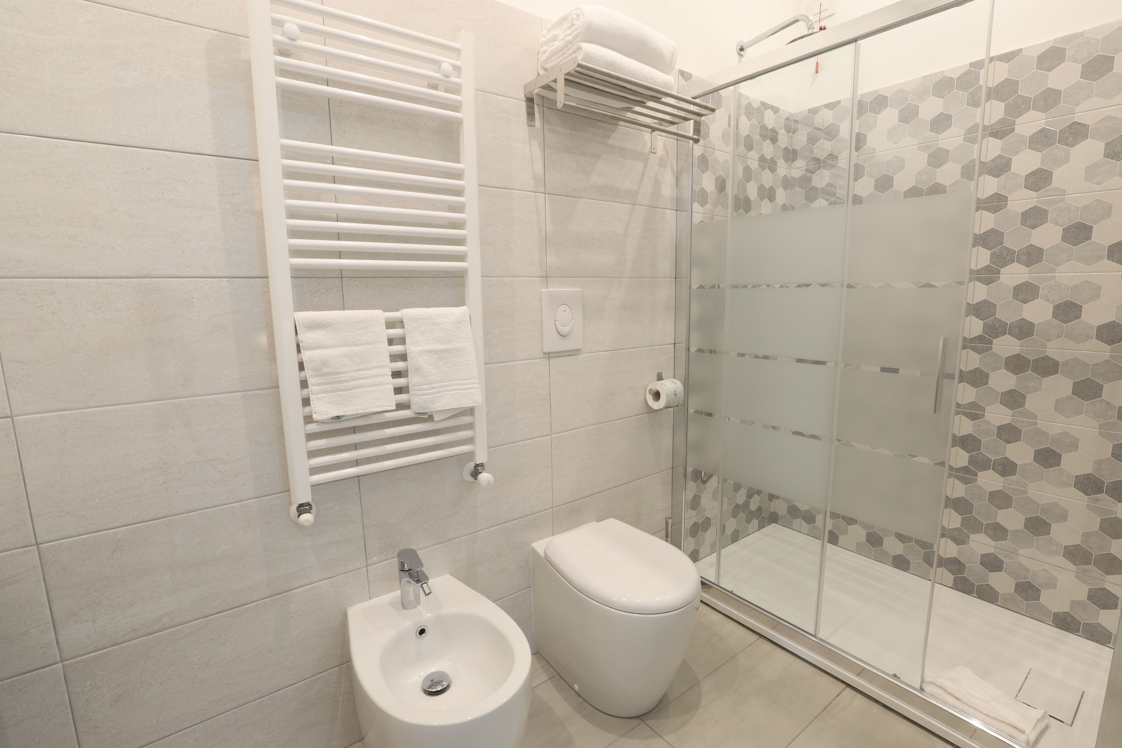 hair dryer, bidet, towels, soap