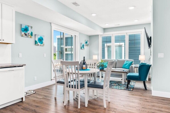 Relax in this stylish room with a dining area, sofa, and TV, plus a kitchenette with a dishwasher.