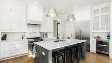 Fridge, dishwasher, coffee/tea maker, cookware/dishes/utensils