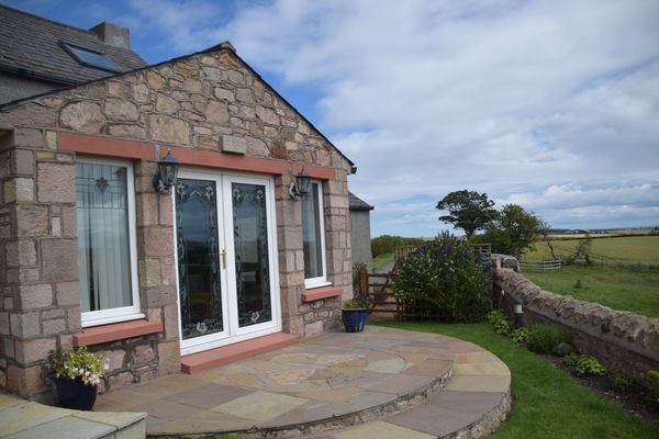Relax and enjoy the views from the cottage's sunroom