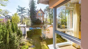 A residential area with a house, a small shed, and a bicycle. - House on the hill, Die Moderne 11 (Heringsdorf)