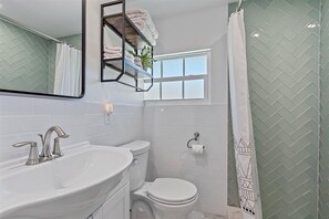 Shower, hair dryer, towels, toilet paper