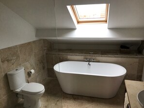 Bathtub, hair dryer, towels, soap