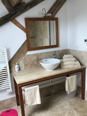 Bathtub, hair dryer, towels, soap