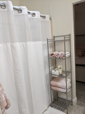 Bathtub, towels, toilet paper