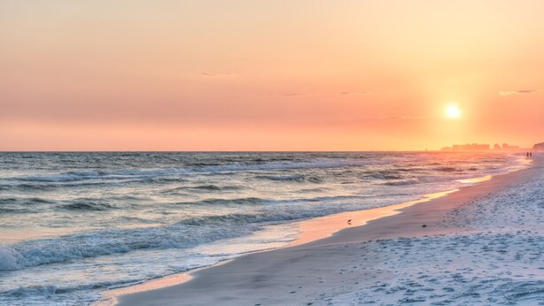A beach with waves and a sunset. - Miramar Beach Condo: Pool, Hot Tub, Beach (Miramar Beach)