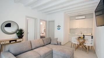 Superior Apartment | Living area | 40-inch flat-screen TV with satellite channels, TV, offices